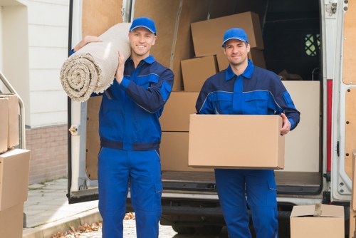 Removal team preparing a move in Knightsbridge with boxes and furniture