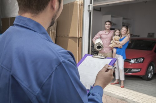 Professional movers handling furniture in a Knightsbridge apartment building