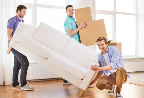 Professional team handling furniture dismantling for pick-up