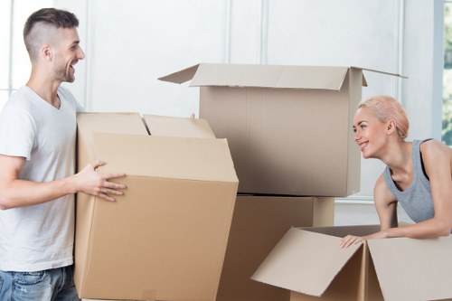 Removal crew loading boxes and furniture for a central London relocation