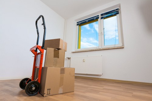 Local removal team moving furniture from a Knightsbridge townhouse