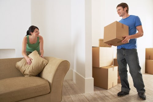 Professional movers handling furniture in a Knightsbridge apartment
